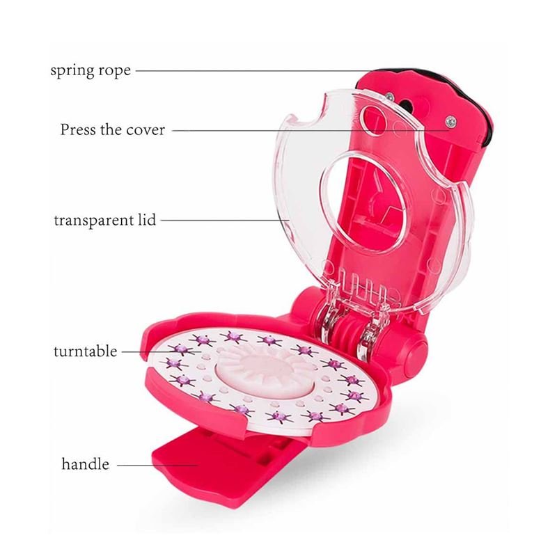 The Fashiongirl Bling Bling Ultimate Glam Kit - 180 Diamonds includes a pink and white toy machine with labeled parts—spring rope, press cover, transparent lid, star turntable, and handle—ideal for organizing bling hair accessories or sparkly diamond stones.