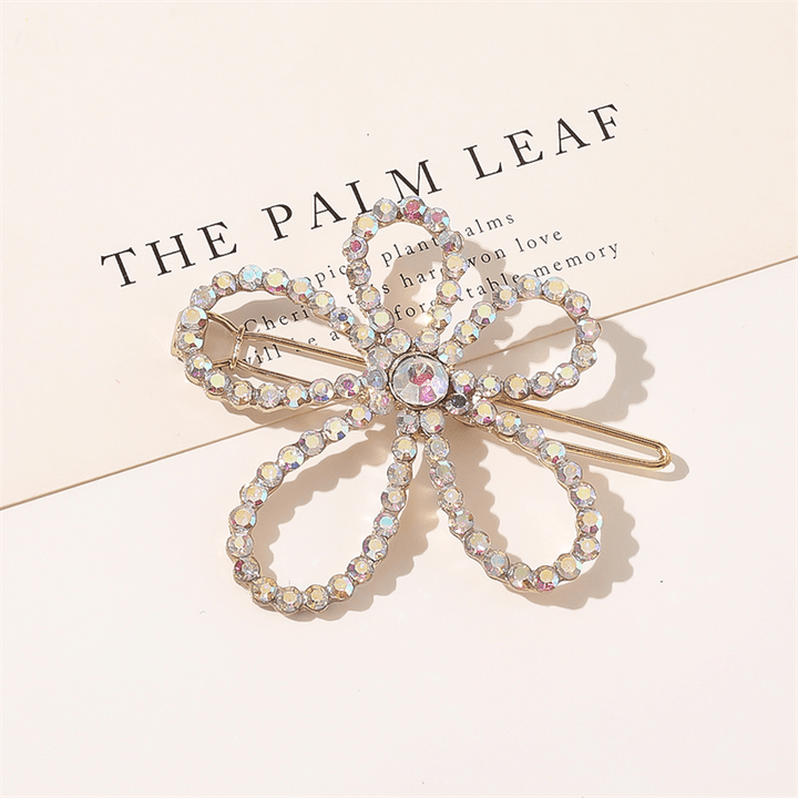 Chris Rubin Evie Hair Claw Gold – Flower – Haaraccessoires | Fashiongirl