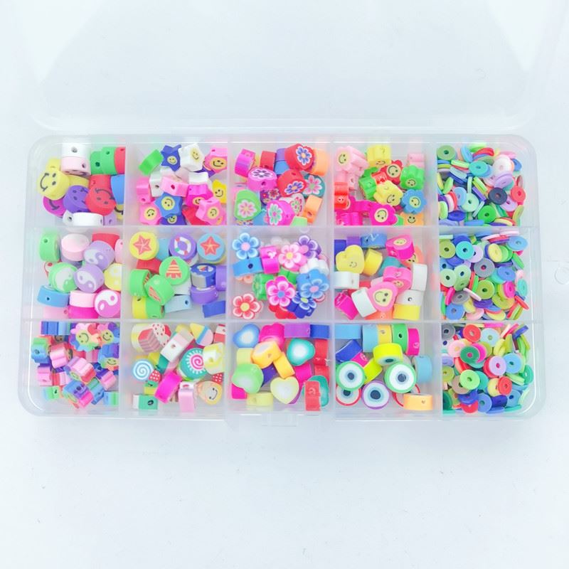 The Fashiongirl Clay Beads / Heishi Beads Fimo Kit - KREA DIY Jewellery Kit includes 4500 colorful beads in assorted shapes like flowers, hearts, stars, fruit slices, and smiley faces in a 15-compartment plastic organizer—perfect for jewellery making.