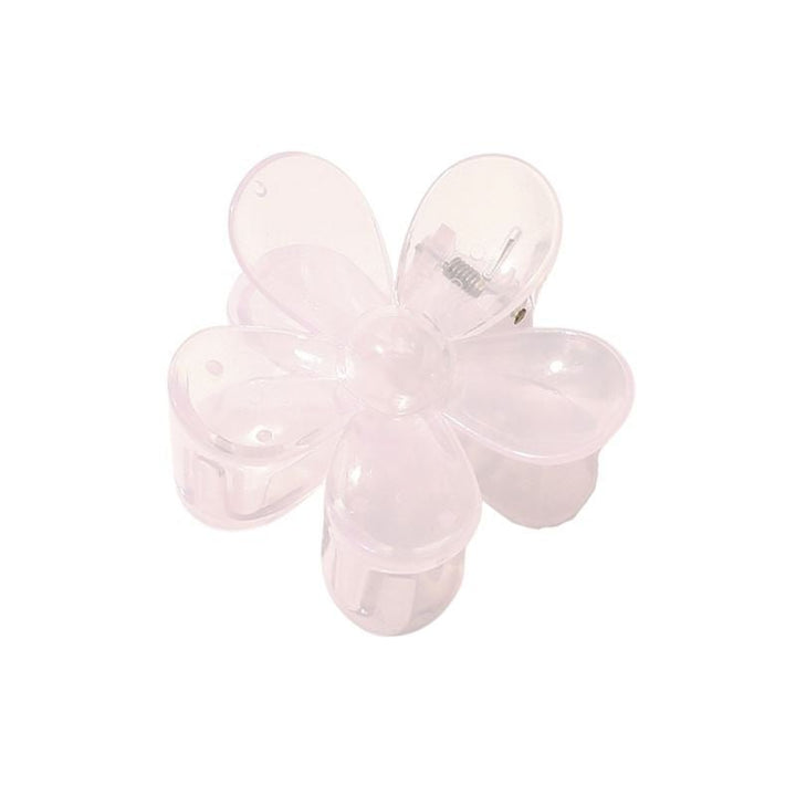 The SOHO Fiore Hair Claw in Pale Purple is a translucent, flower-shaped hair accessory with five rounded petals by SOHO, shown from above on a white background.