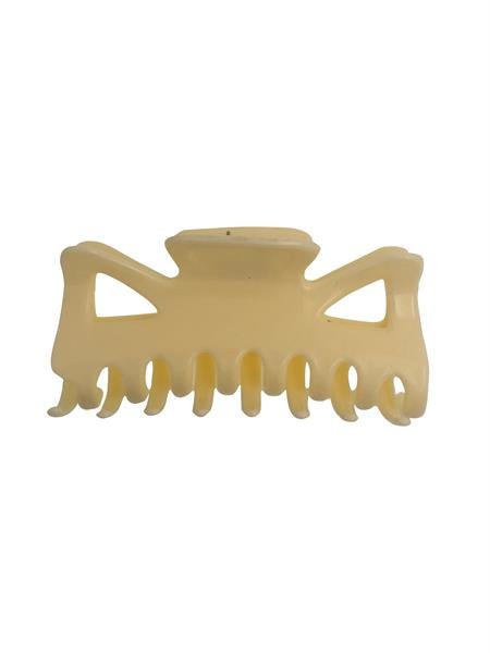The SOHO Hair Claw in creamy white, featuring interlocking teeth and triangular cutout designs, is shown against a white background.