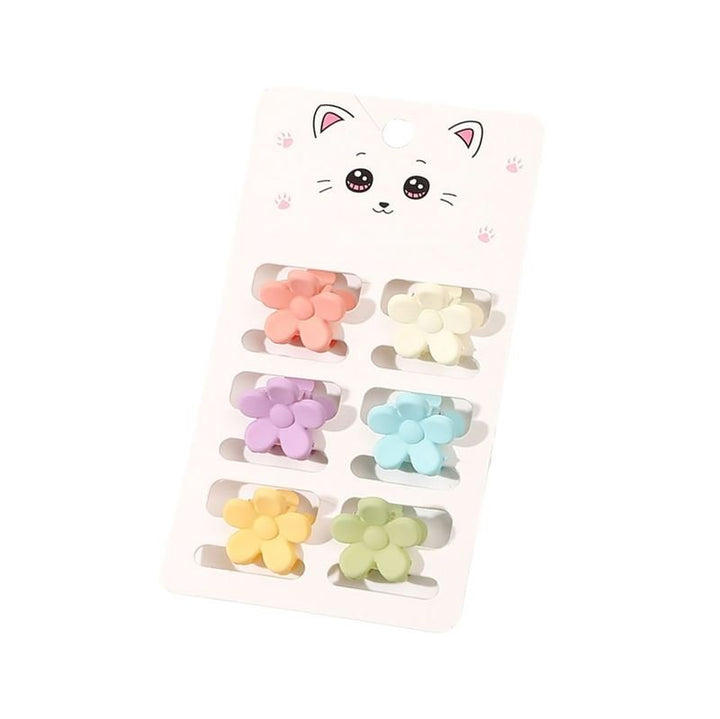 The SOHO Lala Mini Hair Claws - Pastel Flowers by SOHO feature six pastel floral hair claws in pink, yellow, purple, blue, orange, and green, presented on a card with a cute cat face illustration.