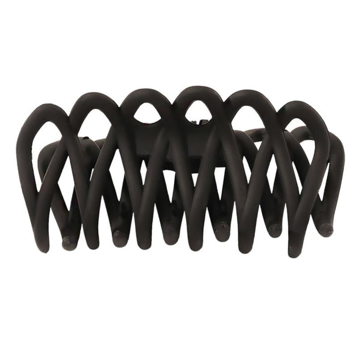 The SOHO Olive Hair Claw - Black by SOHO features interlocking curved prongs for a gentle grip, ideal for all hair types. Matte black finish. Pictured from the side against a white background.