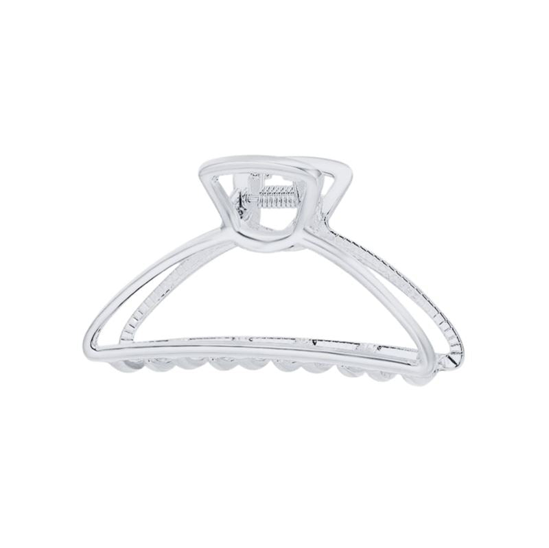 The SOHO Tori Small Metal Hair Claw in matt silver features a spring hinge and ridged teeth for secure messy bun styling—a stylish SOHO accessory shown against a white background.