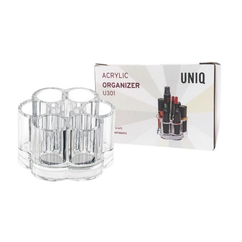 The UNIQ Flower Makeup Acrylic Organiser - U301 by UNIQ is shown beside its box, which features the product name and an image of the organiser neatly storing makeup items in multiple clear compartments.