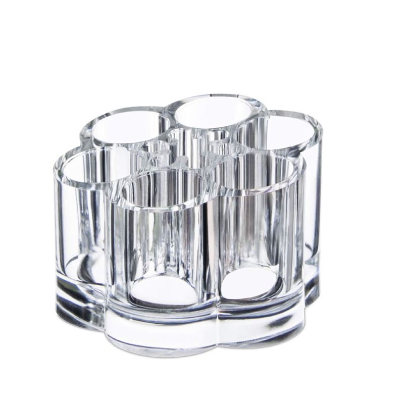 The UNIQ Flower Makeup Acrylic Organiser - U301 by UNIQ features seven honeycomb compartments, ideal for storing makeup, pens, brushes, and beauty tools in a clear cylindrical design.