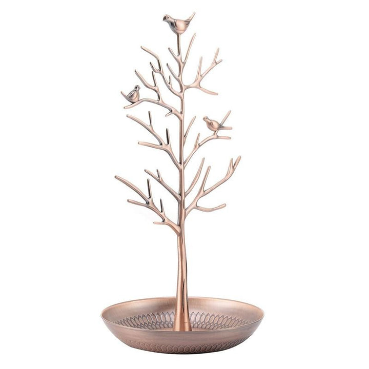 The UNIQ Bronze Vintage Jewelry Tree with 3 Birds is a jewelry organizer display stand shaped like a tree, featuring three birds on its branches and a round ornate tray.